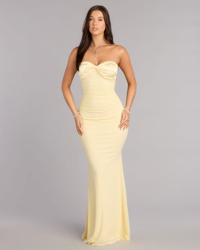 Own Prom 2026 in the Iris Satin Tie-Back Mesh Mermaid Dress,  a yellow prom dress designed with a flattering silhouette and elevated details that feel modern and true to your style.