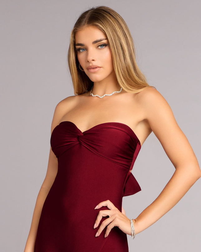 Choose a wine A-line dress like the Madeline Strapless Tie-Back A-Line Dress, featuring a fitted waist and flared skirt for a flattering, comfortable fit for casual or formal occasions.
